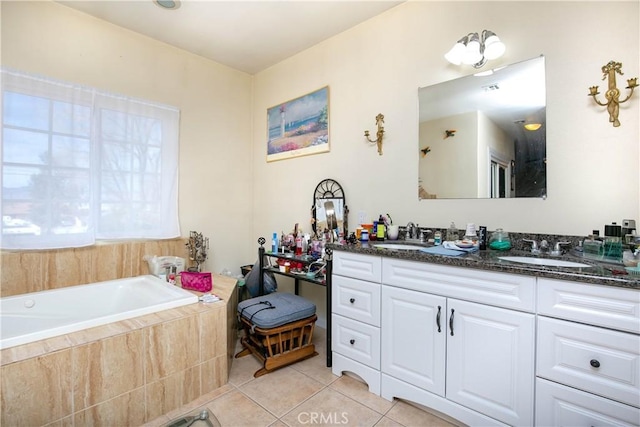 bathroom with a garden tub, double vanity, tile patterned flooring, and a sink