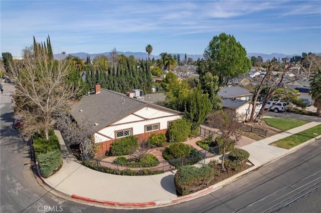 birds eye view of property with a mountain view and a residential view