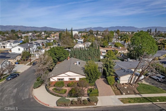 drone / aerial view with a residential view and a mountain view