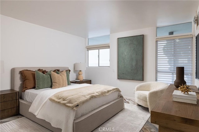 bedroom featuring wood finished floors