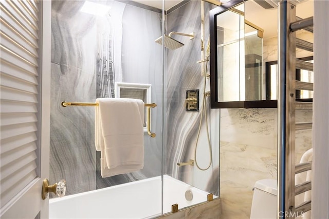 full bathroom with combined bath / shower with glass door and toilet