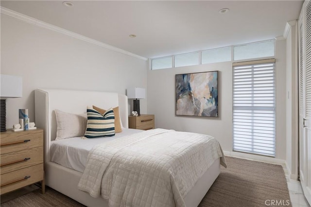 bedroom with multiple windows, baseboards, ornamental molding, and recessed lighting
