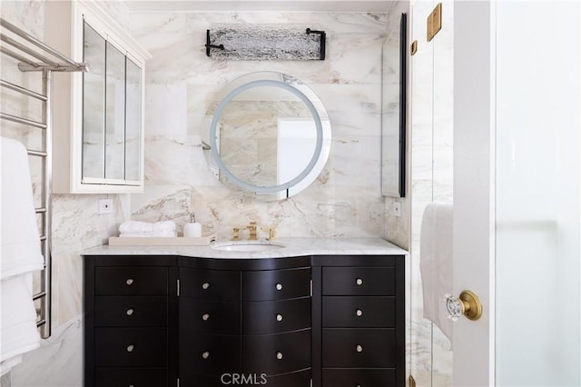 bathroom featuring decorative backsplash and vanity