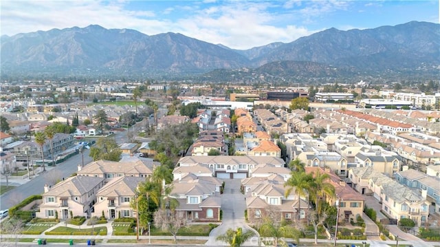 birds eye view of property with a residential view and a mountain view