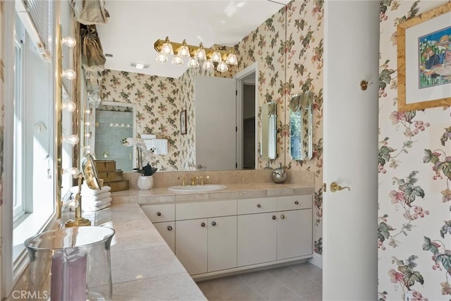 bathroom with tile patterned floors, vanity, and wallpapered walls