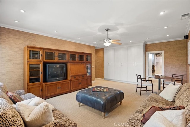 living room with light carpet, visible vents, ceiling fan, crown molding, and recessed lighting