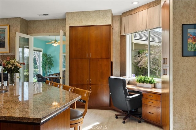 office featuring visible vents and wallpapered walls