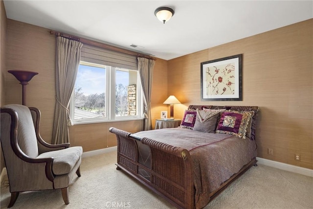 carpeted bedroom featuring baseboards and visible vents