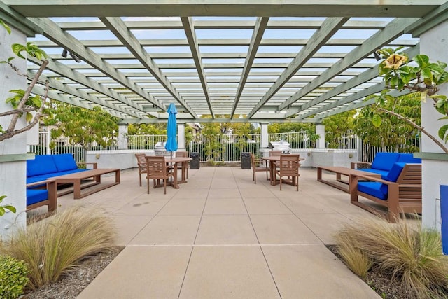 view of patio / terrace featuring outdoor dining space, fence, and a pergola