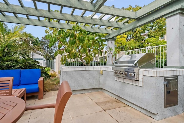 view of patio / terrace featuring grilling area, an outdoor kitchen, fence, a pergola, and an outdoor living space