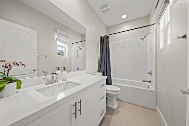 full bath featuring shower / tub combo with curtain, visible vents, toilet, vanity, and tile patterned flooring