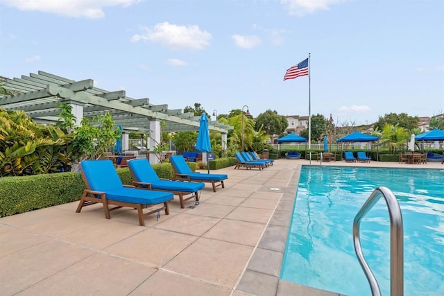 pool featuring a patio area, fence, and a pergola