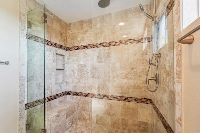 bathroom with a shower stall