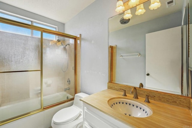 bathroom with toilet, combined bath / shower with glass door, vanity, and visible vents