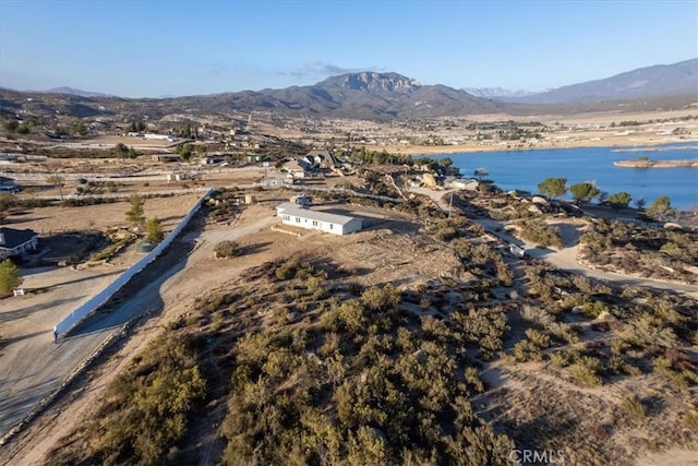 drone / aerial view featuring a water and mountain view