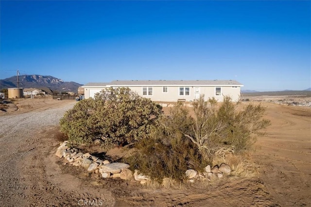 exterior space featuring a mountain view