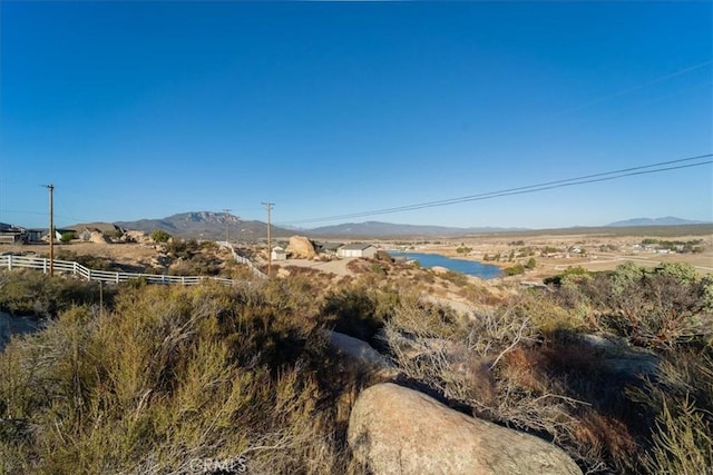 mountain view featuring a rural view and a water view