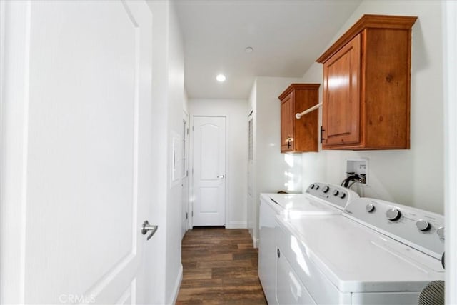 washroom with dark wood finished floors, washer and clothes dryer, recessed lighting, cabinet space, and baseboards