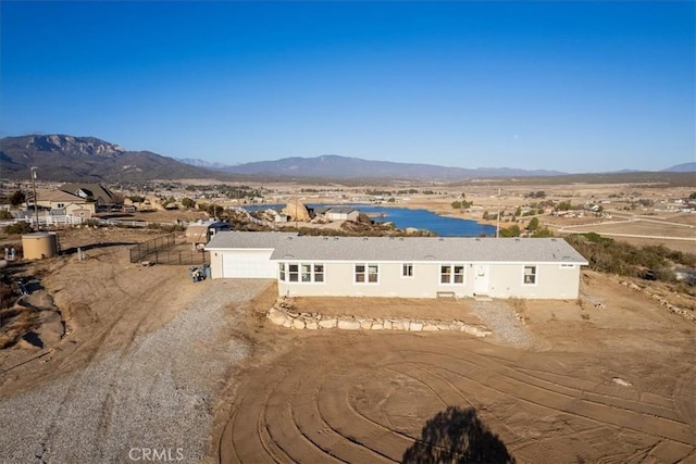 birds eye view of property with a mountain view