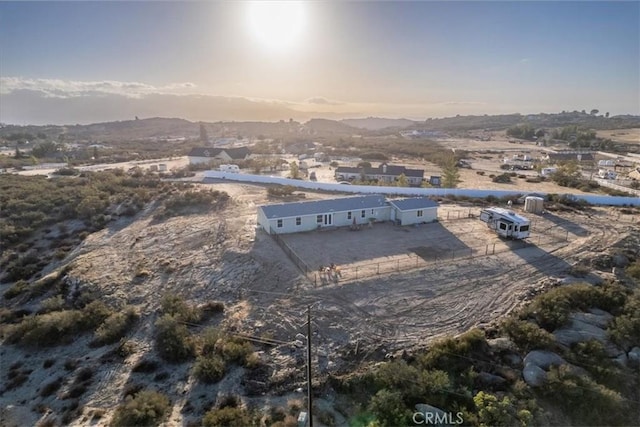 birds eye view of property featuring a mountain view