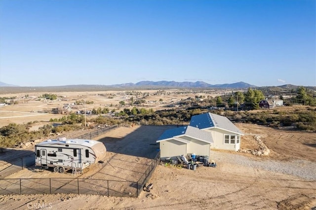 birds eye view of property featuring a mountain view