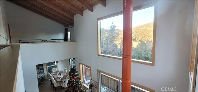 interior space featuring vaulted ceiling with beams and wood ceiling