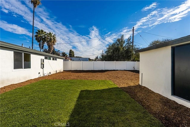 view of yard with a fenced backyard