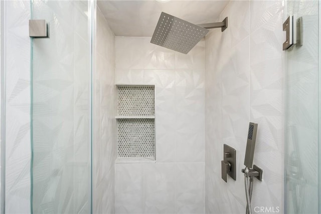 bathroom with a shower stall