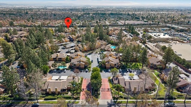 birds eye view of property with a residential view