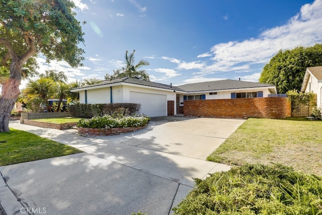 single story home featuring concrete driveway, an attached garage, fence, a front yard, and brick siding