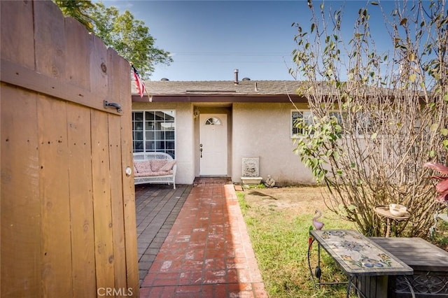 view of front facade featuring a patio area and stucco siding