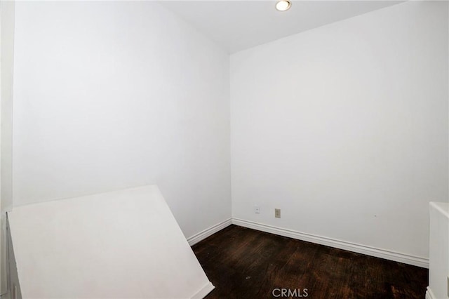 435 S La Fayette Park Pl Unit 311, Los Angeles, CA 90057 - unfurnished room with dark wood-style flooring, baseboards, and recessed lighting