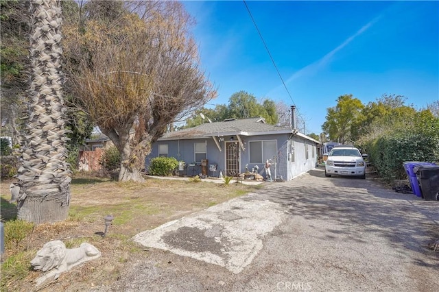 10917 Locust Ave, Bloomington, CA 92316 - view of front of house with aphalt driveway and stucco siding