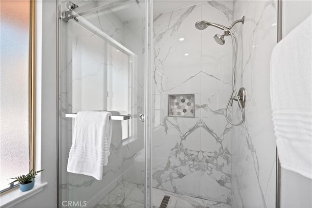 full bathroom featuring a marble finish shower