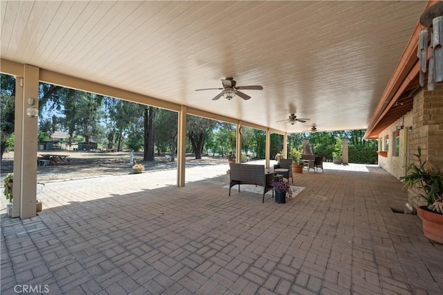 view of patio with an outdoor hangout area and a ceiling fan