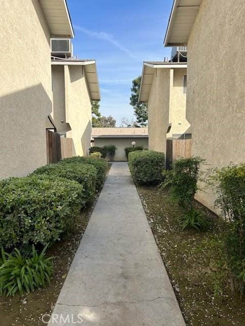 view of property exterior featuring fence and stucco siding