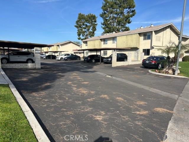 partially covered parking lot with a residential view