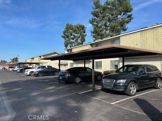 view of partially covered parking lot