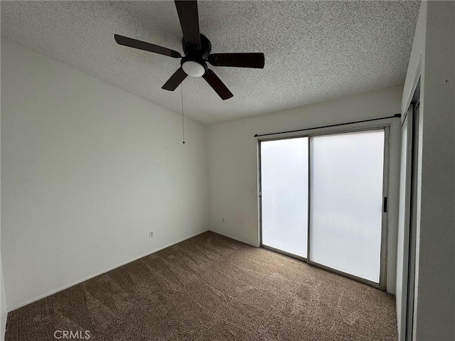 unfurnished bedroom with carpet, ceiling fan, and a textured ceiling