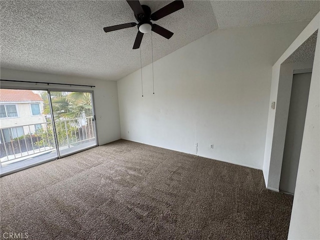 empty room with lofted ceiling, carpet, a ceiling fan, and a textured ceiling