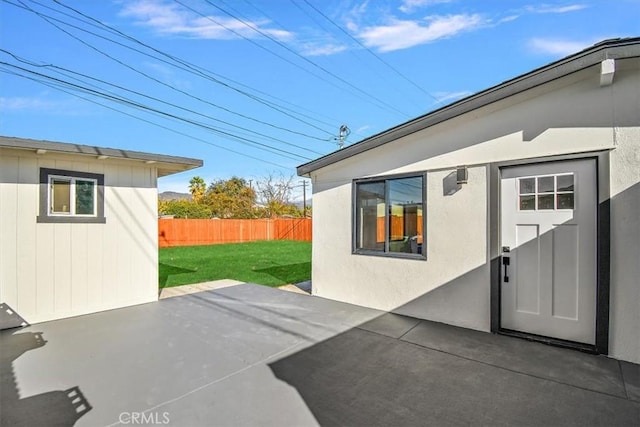 view of patio featuring fence