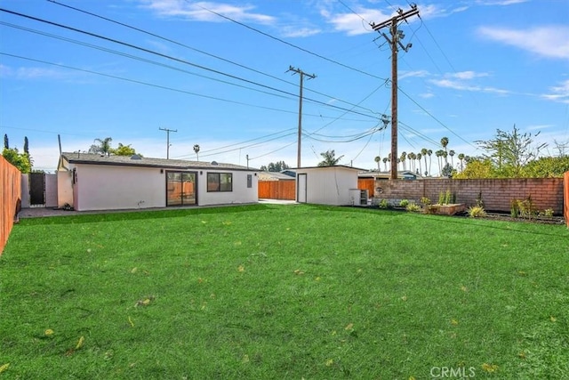 view of yard with a fenced backyard