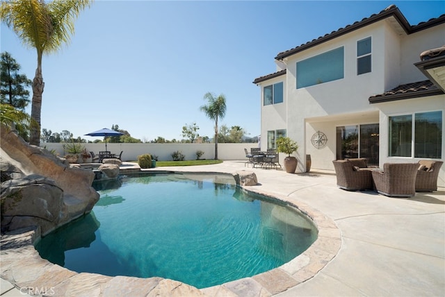 view of swimming pool with a fenced in pool, a fenced backyard, a patio area, outdoor dining area, and an outdoor living space