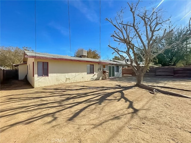 back of property with fence