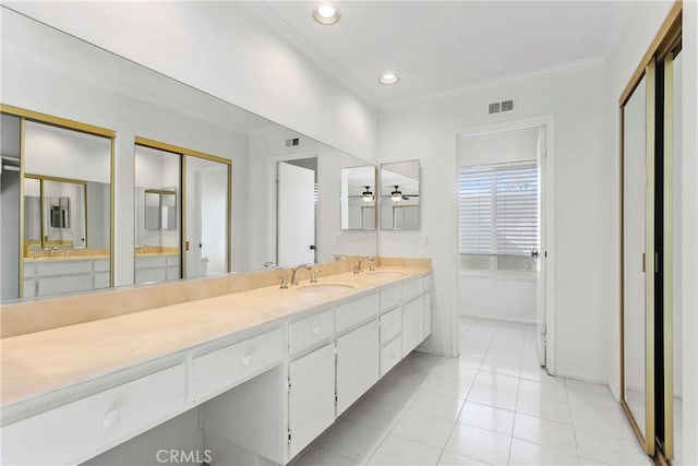 full bath featuring double vanity, visible vents, a sink, and ornamental molding