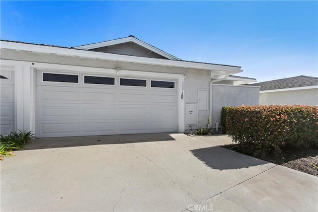 garage featuring driveway