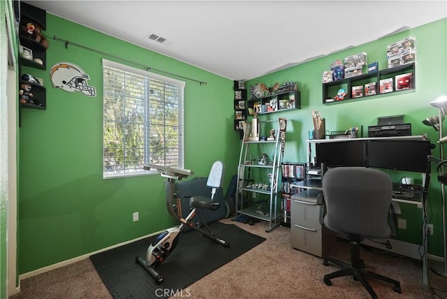 office featuring carpet floors, visible vents, and baseboards