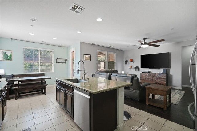 34306 Deergrass Way, Lake Elsinore, CA 92532 - kitchen featuring stainless steel dishwasher, visible vents, ceiling fan, a sink, and light tile patterned floors