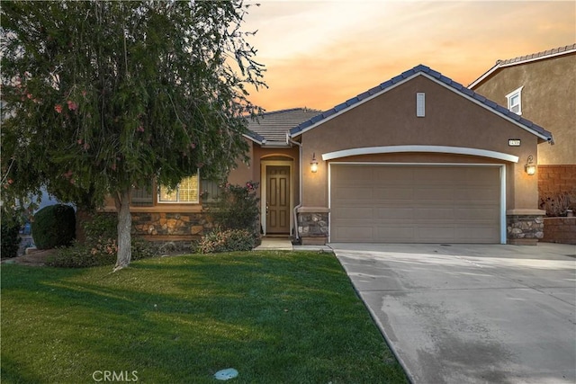 34306 Deergrass Way, Lake Elsinore, CA 92532 - ranch-style home with an attached garage, driveway, stone siding, and stucco siding