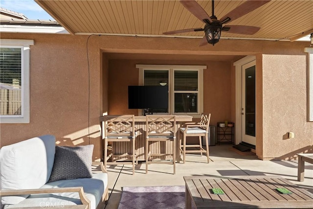 view of patio / terrace with a ceiling fan and outdoor dining space